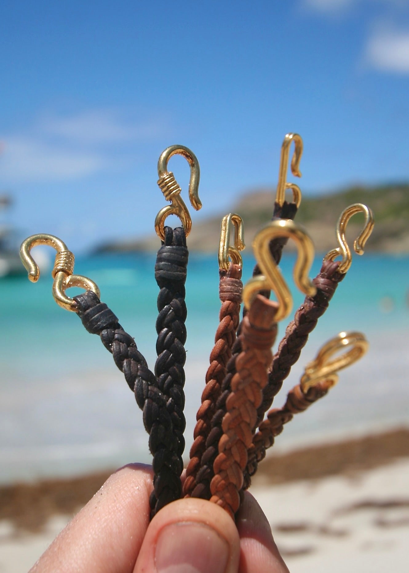 Trésors de St Barth 18K solid gold fish hook bracelets on braided kangaroo leather in multiple colors