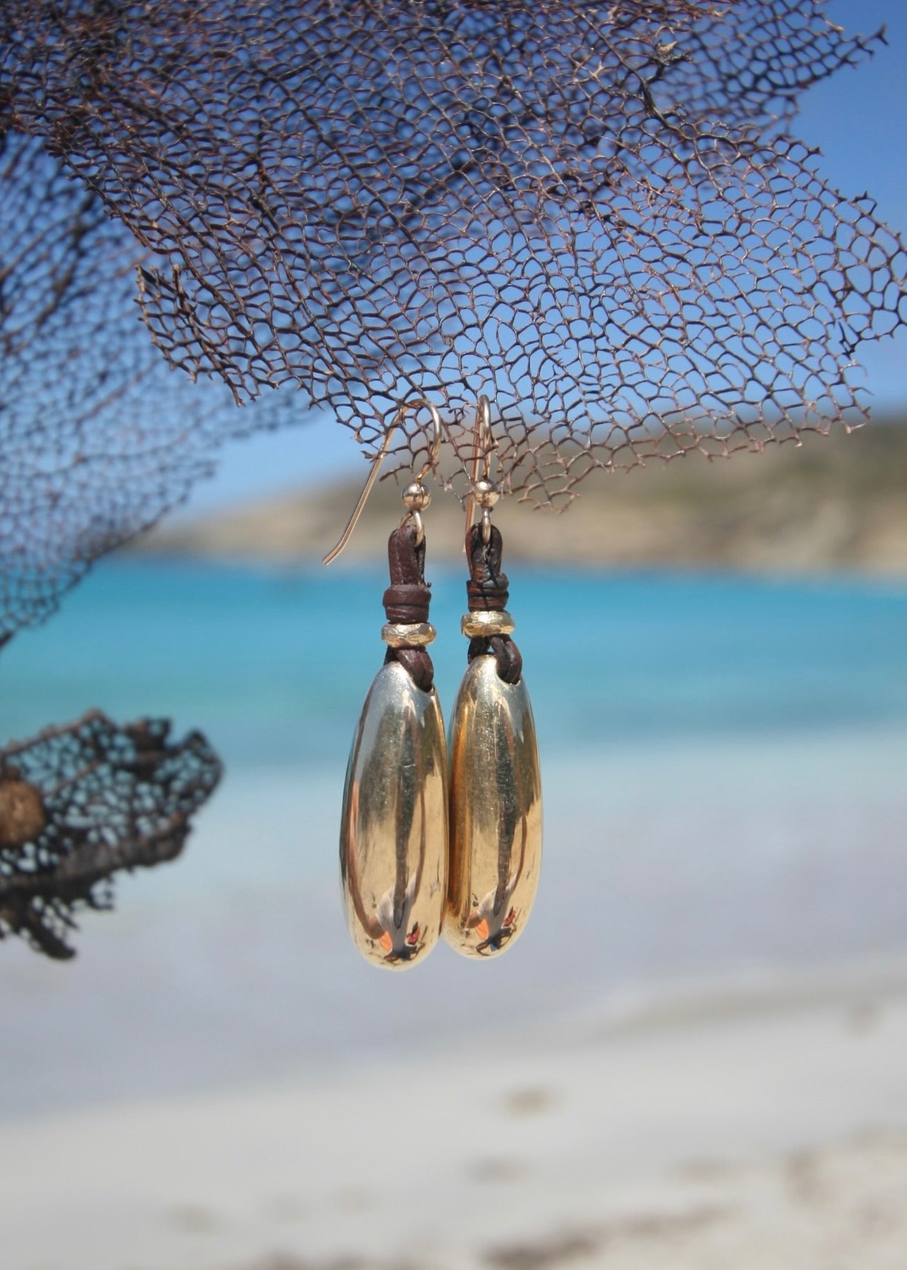 Solid 18K gold pebble drop earrings on leather, St Barth beach net