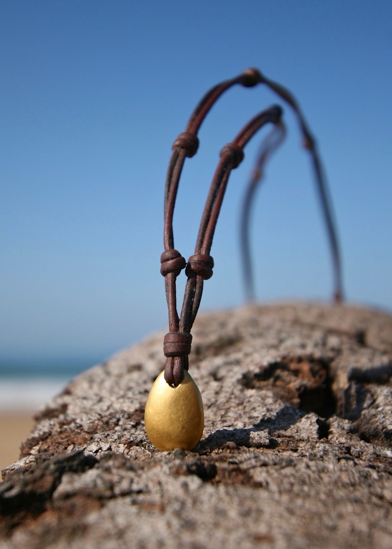 Handmade 24K gold heart pendant on leather, Caribbean beach driftwood