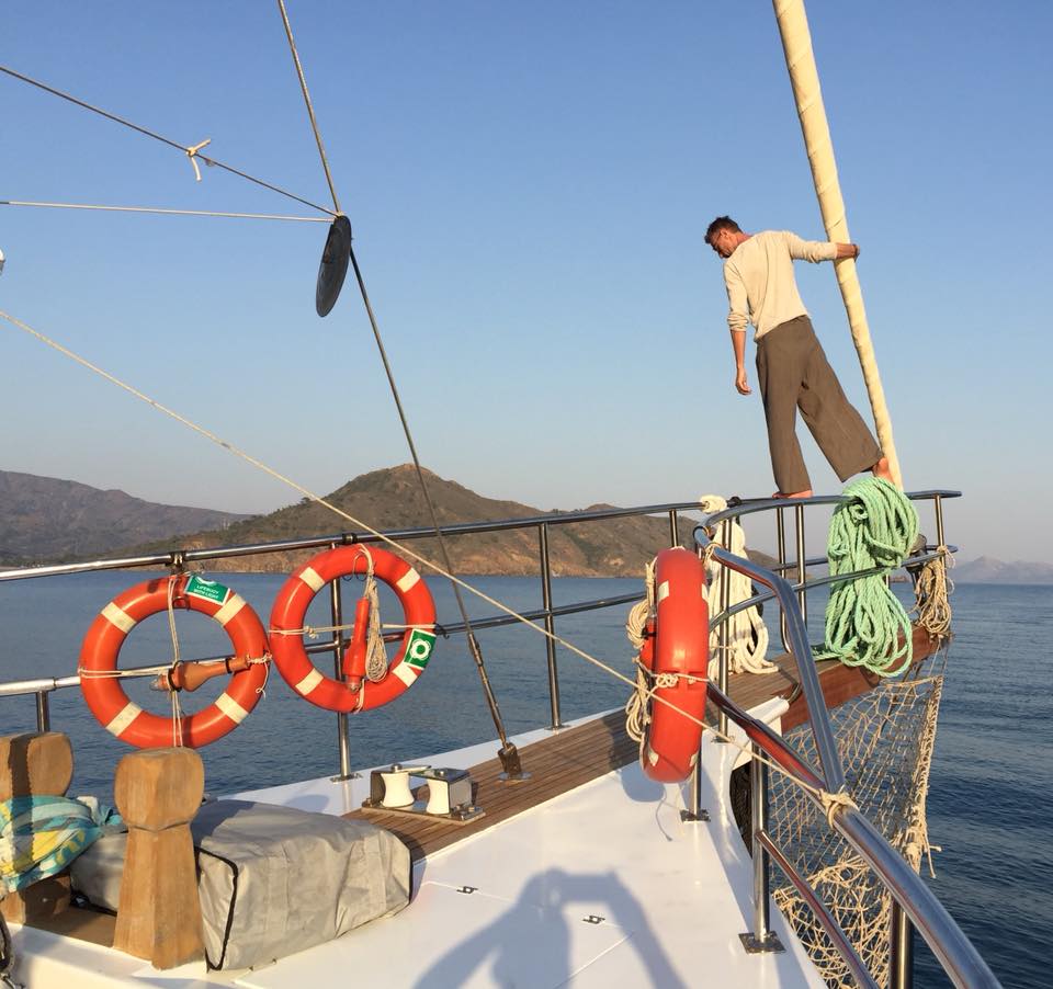 Sailing on the open sea aboard a traditional wooden schooner