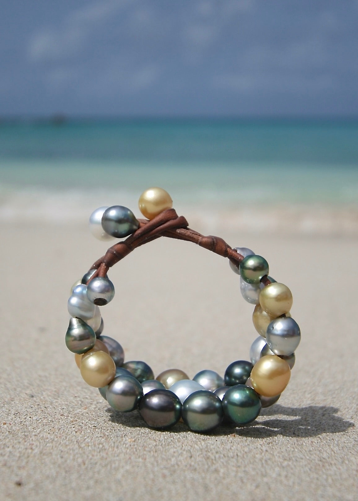 Multicolor Tahitian and Australian pearl cuff bracelet on leather, St Barth beach