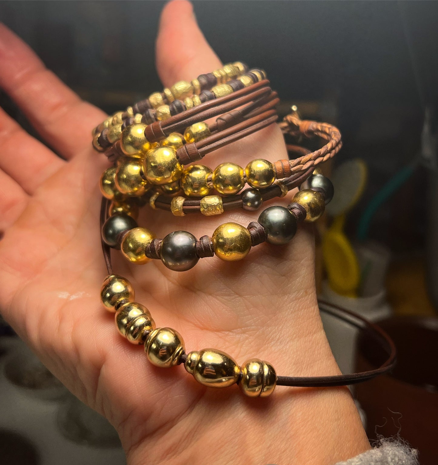 Handmade gold bead and leather bracelet collection, Trésors de St Barth workshop