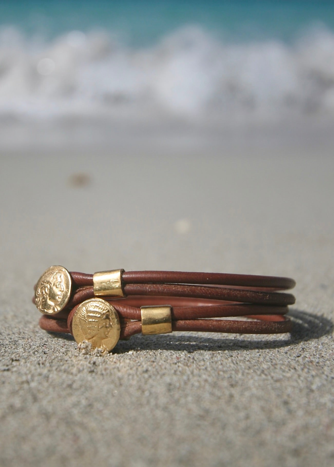 Ancient Greek coin bracelet on kangaroo leather, St Barth beach sand