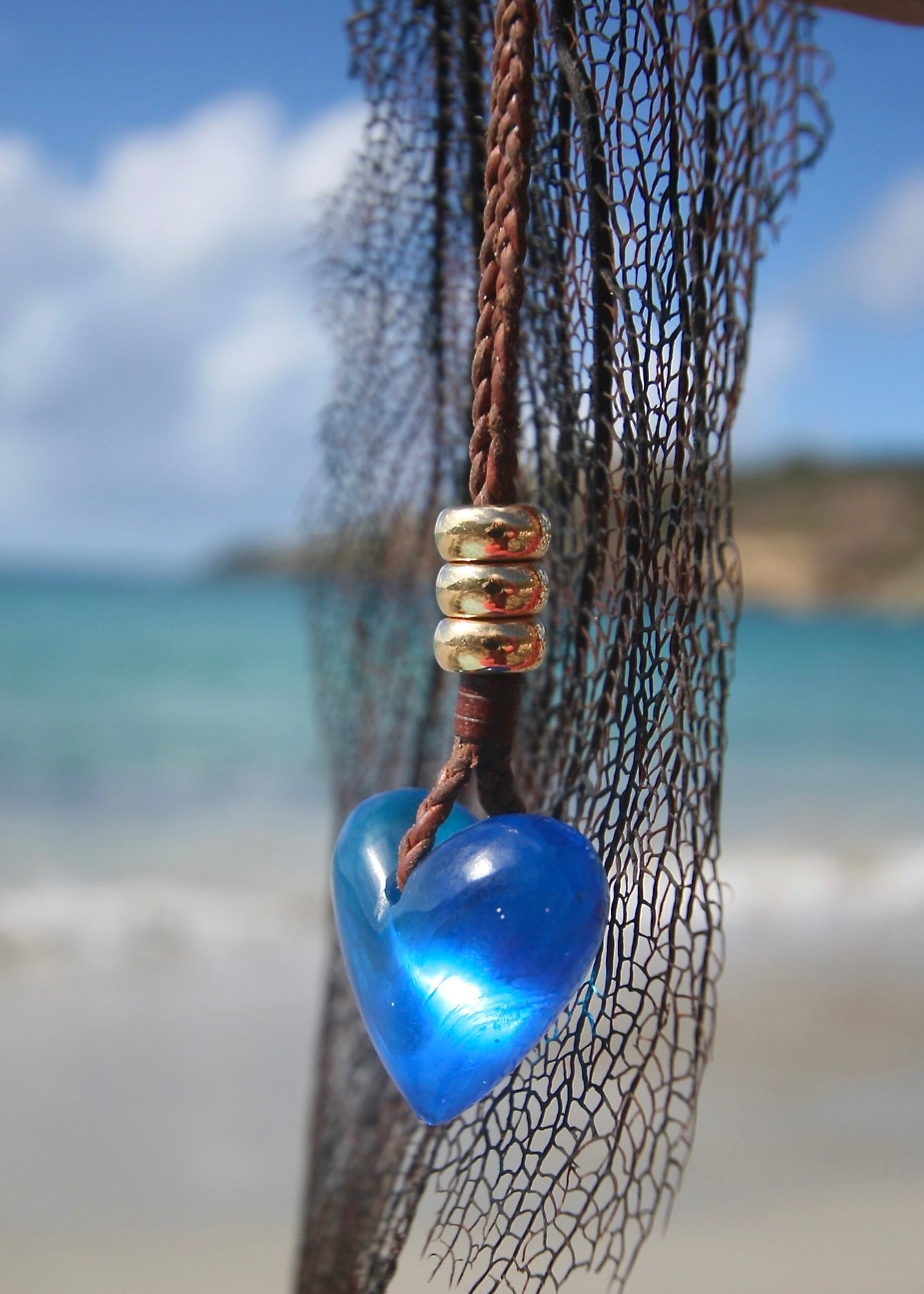 Handmade blue crystal heart necklace on sea net, Caribbean turquoise sea