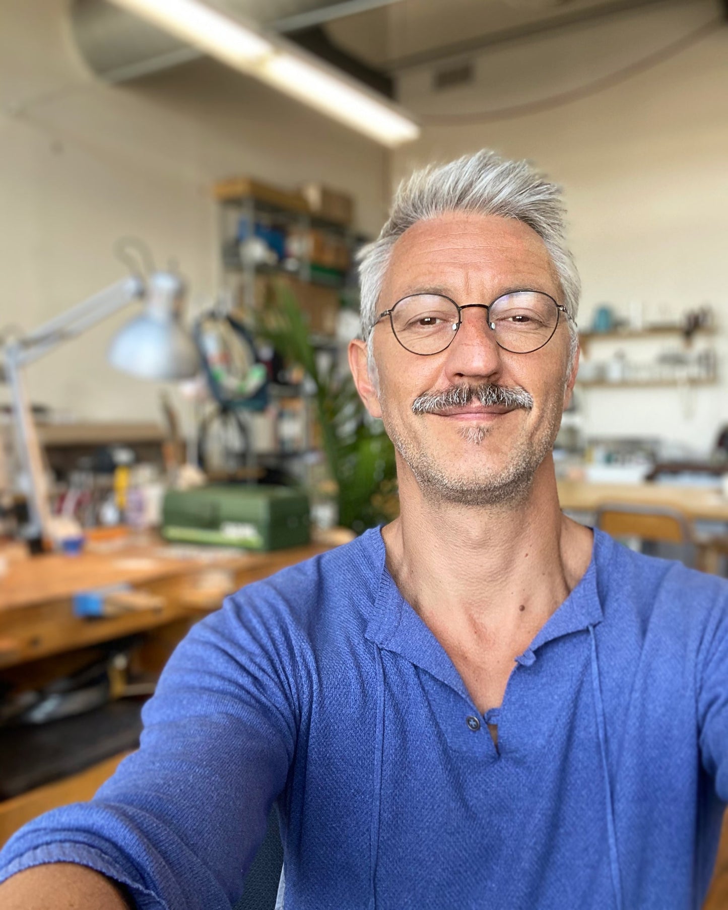 Ted Deltour master jeweler smiling in Montreal atelier, Trésors de St Barth