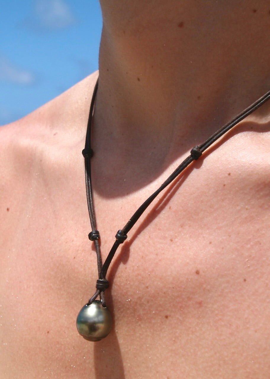 Trésors de St Barth oversized Tahitian pearl leather necklace worn on neck, St Barth