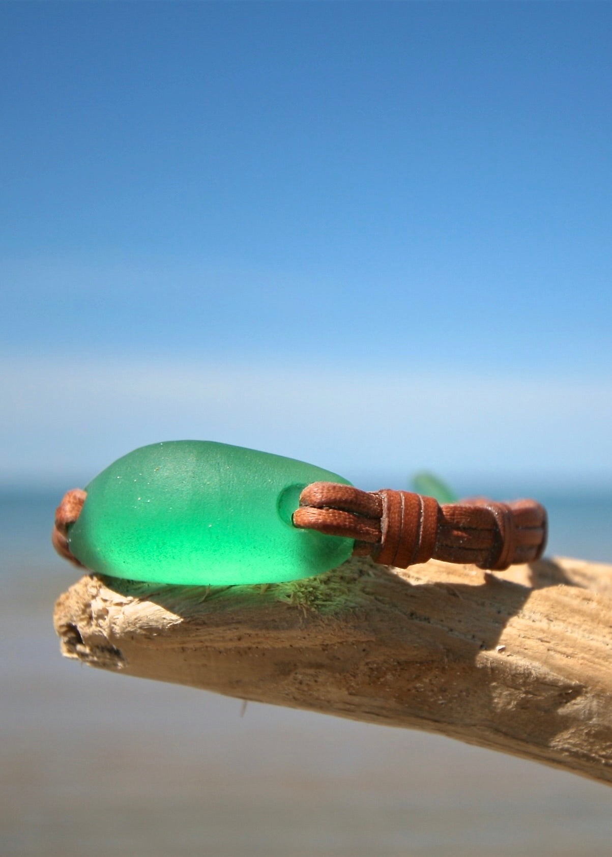 Hand-carved green crystal glass bracelet with frosted sea glass finish on kangaroo leather by Trésors de St Barth