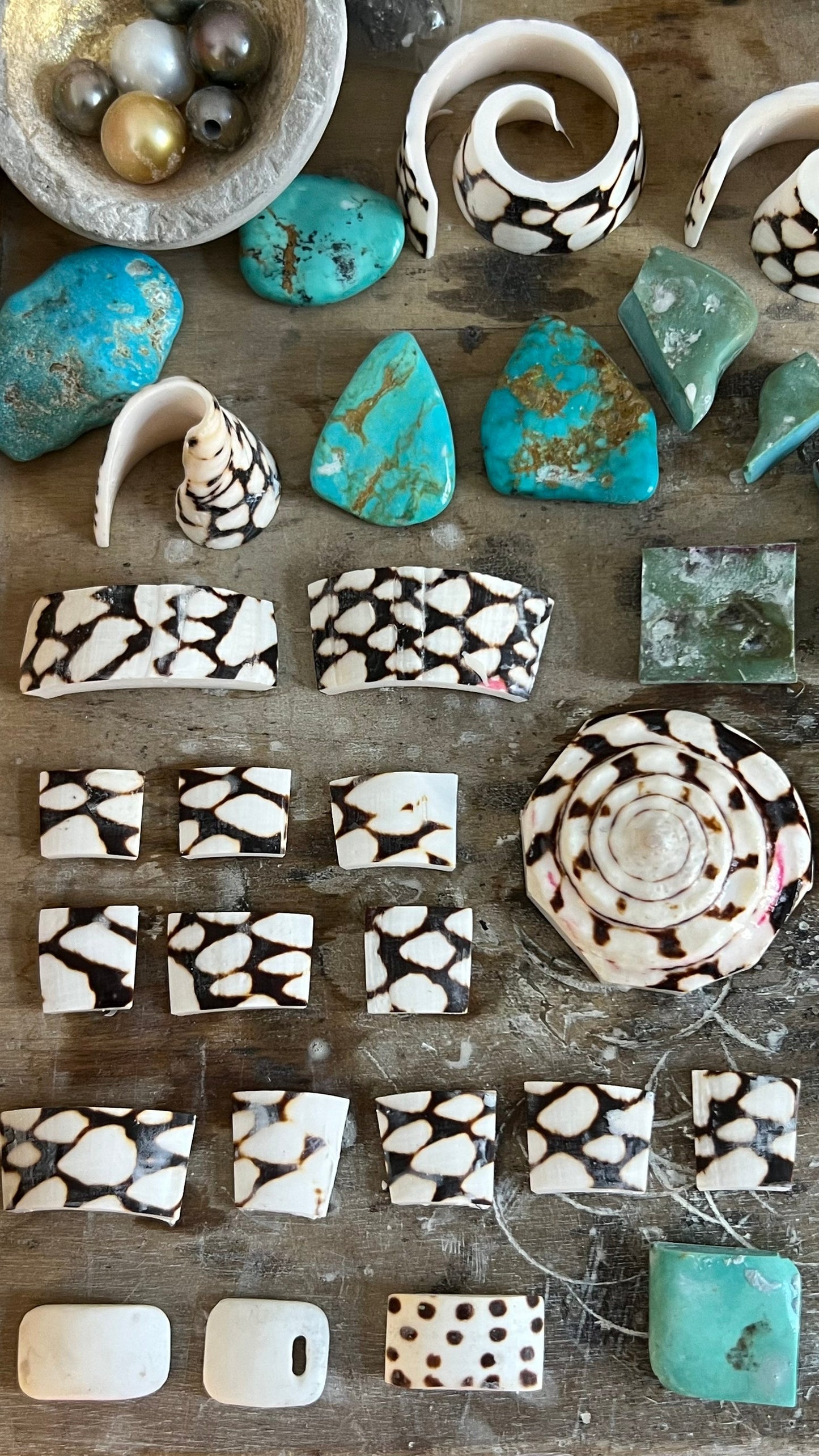 Turquoise, shell and exotic stone selection for handmade jewelry, workshop bench