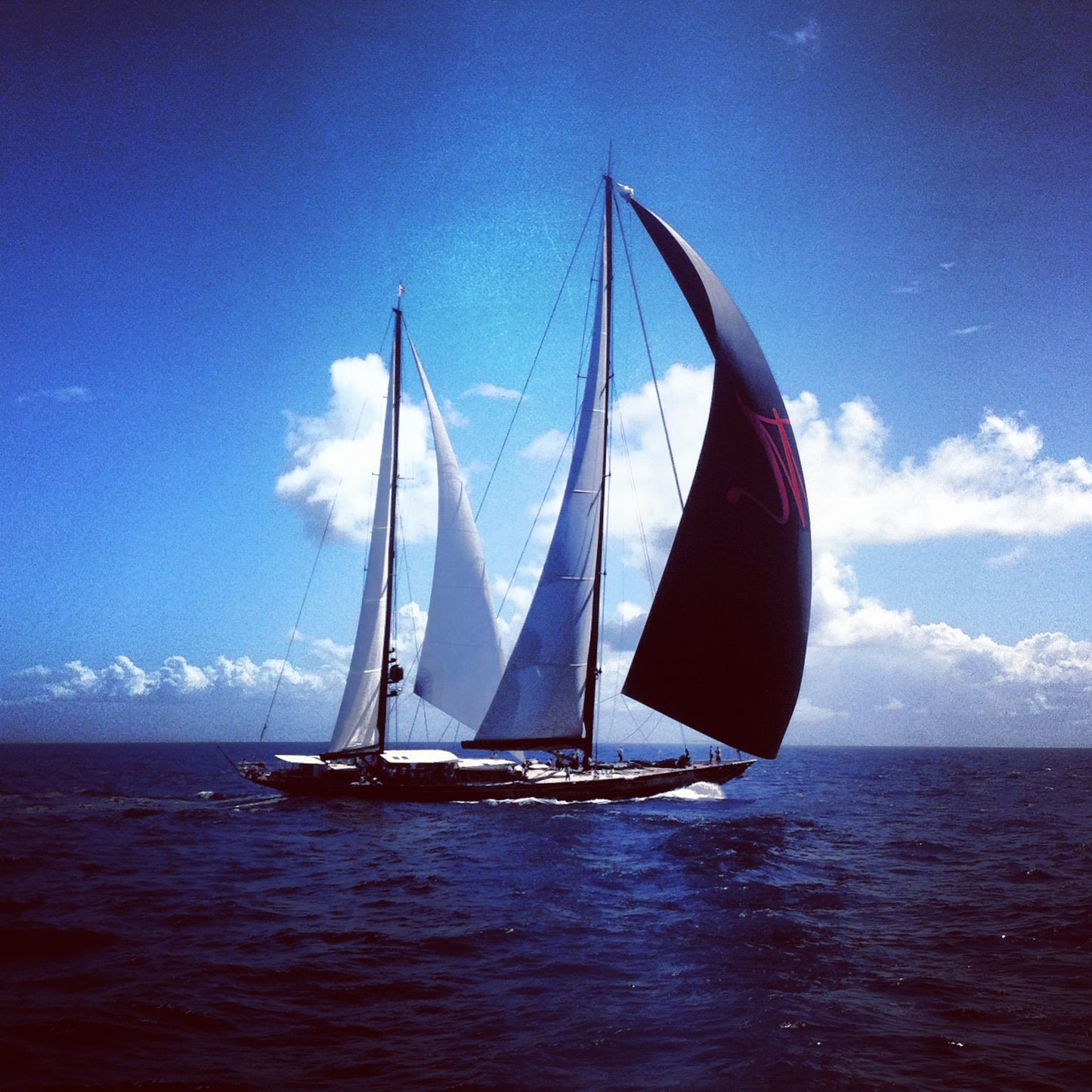 Sailboat racing across deep blue waters off Saint-Barthélemy