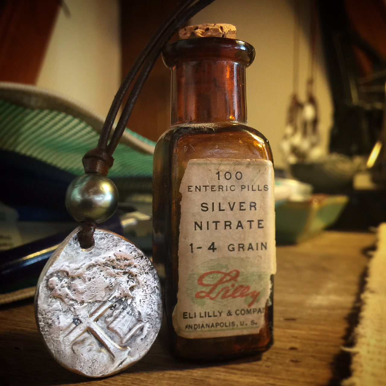 Antique silver nitrate bottle with handmade coin pendant, Trésors de St Barth