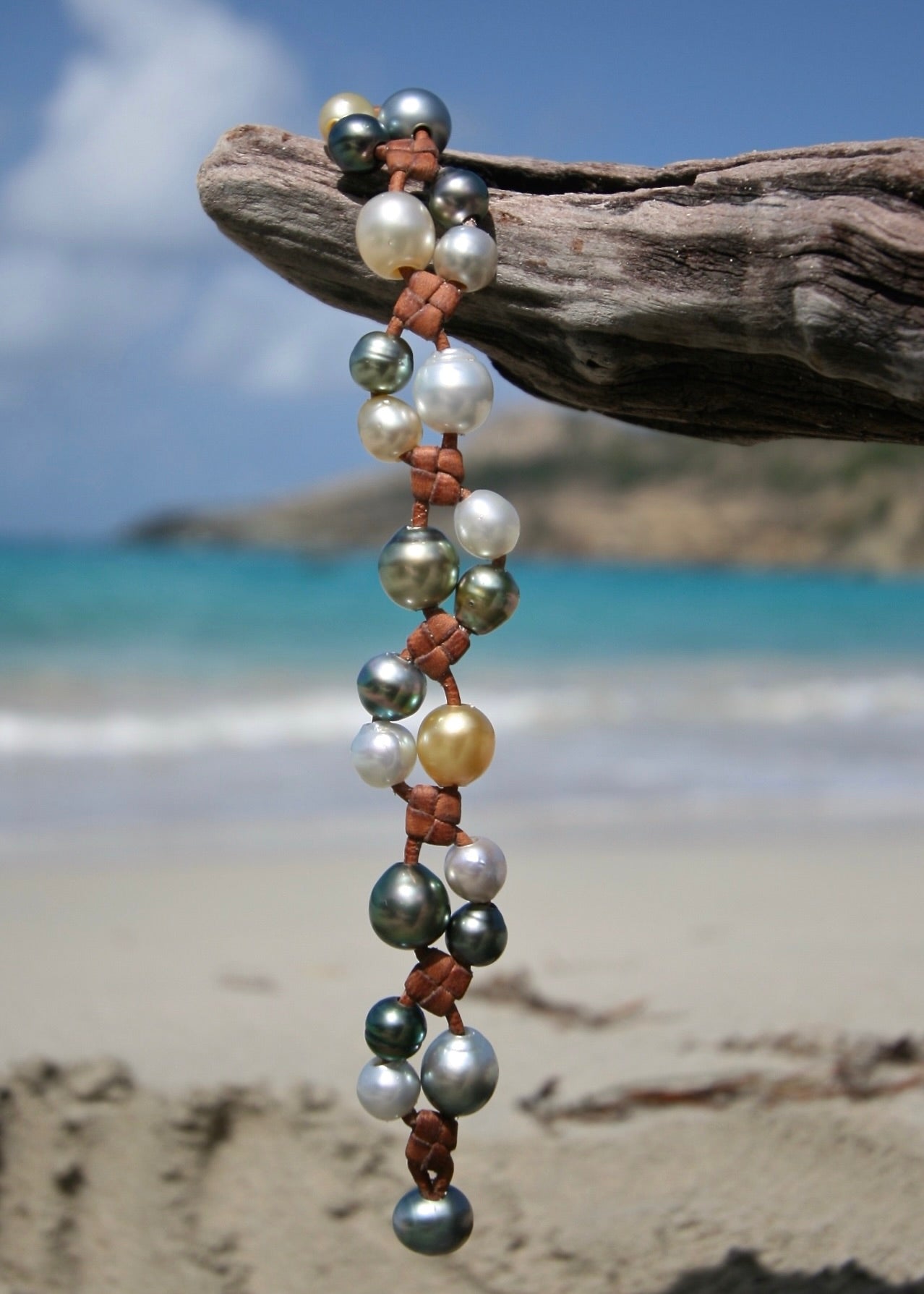 Trésors de St Barth multicolor pearl cluster leather bracelet on driftwood, Caribbean