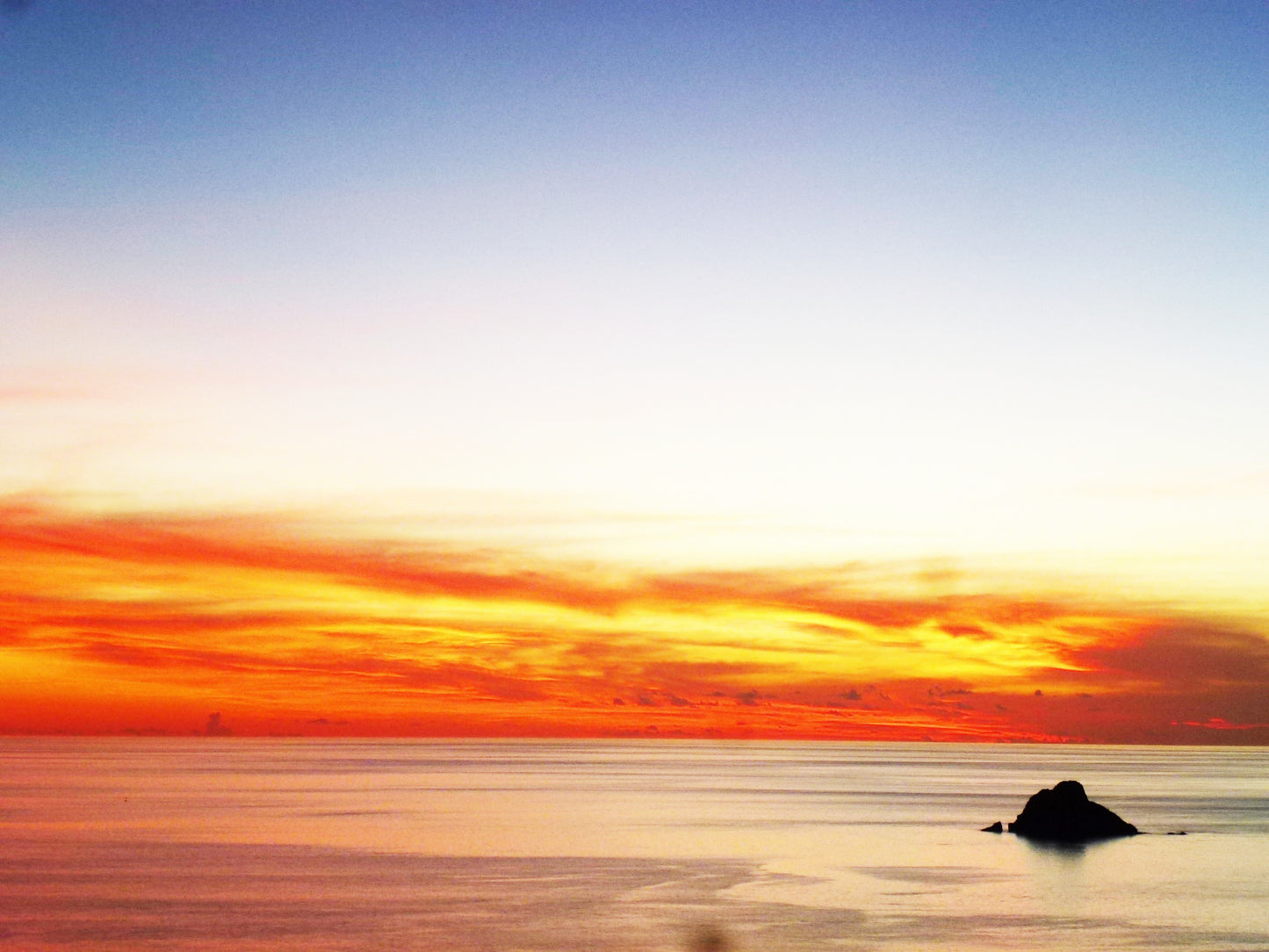 Fiery sunset over the ocean, Saint-Barthélemy atmosphere