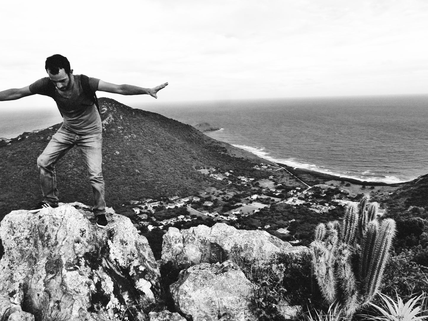 friend balancing on rocks, hilltop view over St Barth