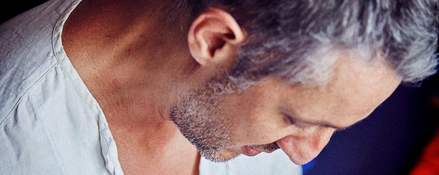 Ted Deltour focused while crafting a piece in his workshop
