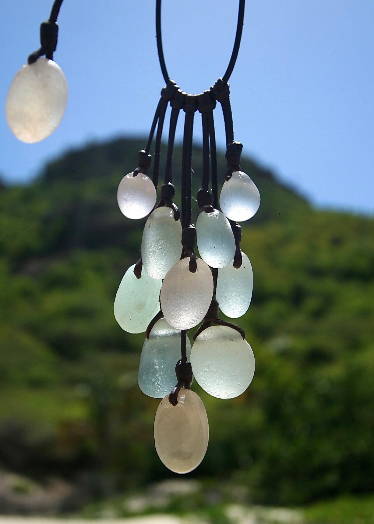 Trésors de St Barth genuine sea glass cascade necklace, island greenery background