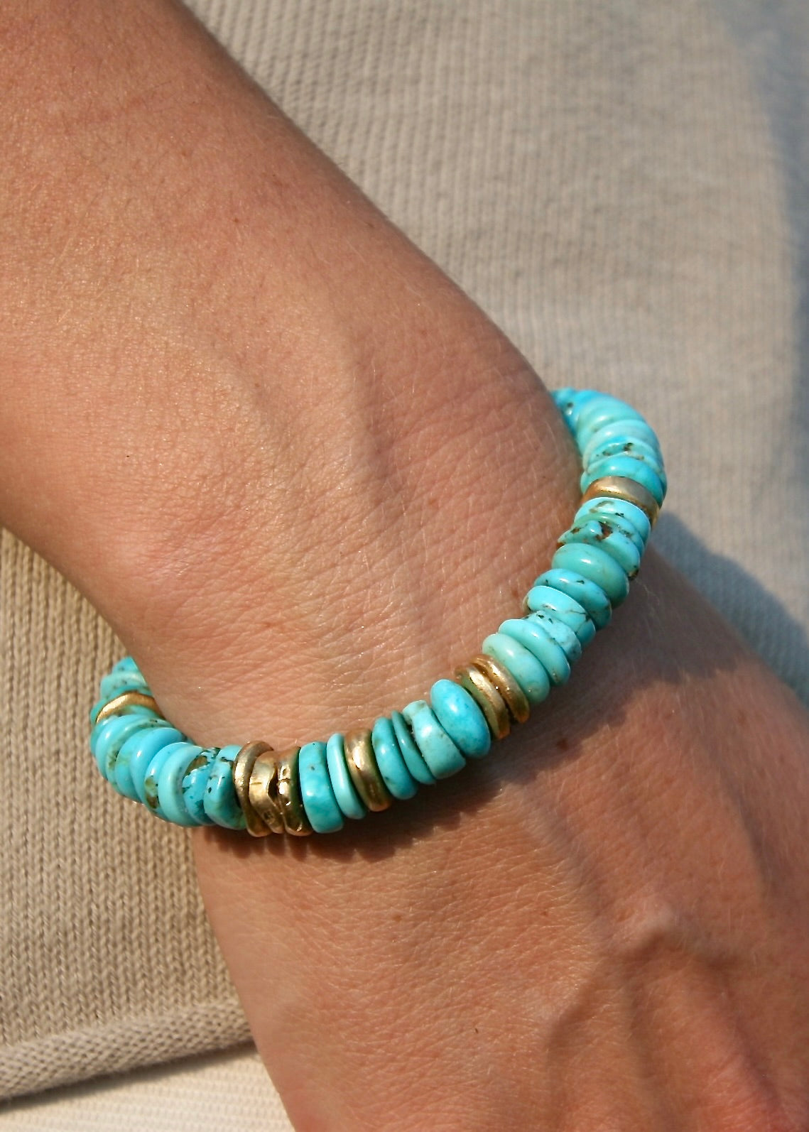 Trésors de St Barth American turquoise and 18K solid gold bracelet on kangaroo leather worn on wrist