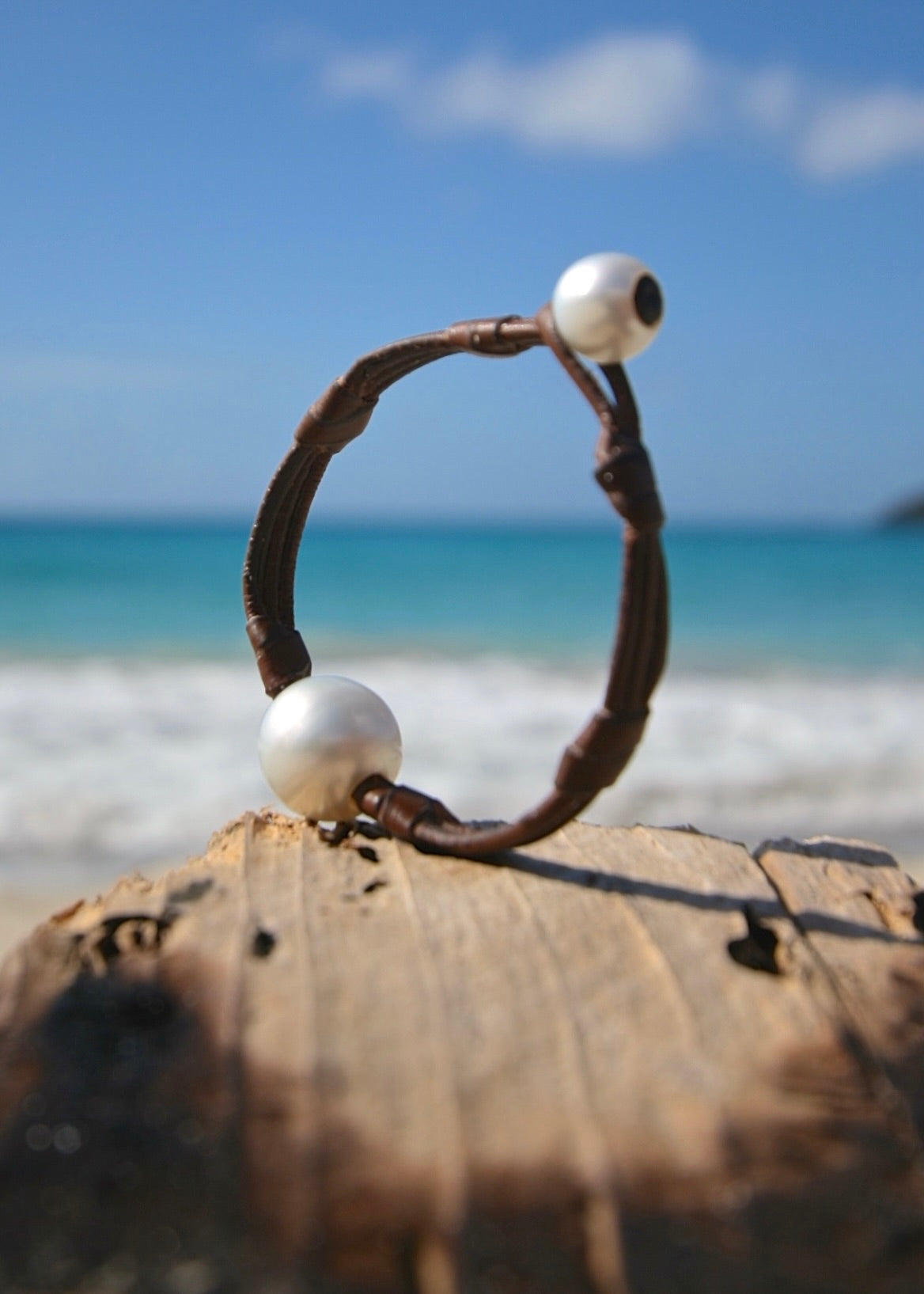 Oversized Australian pearl on leather bracelet, St Barth driftwood close-up