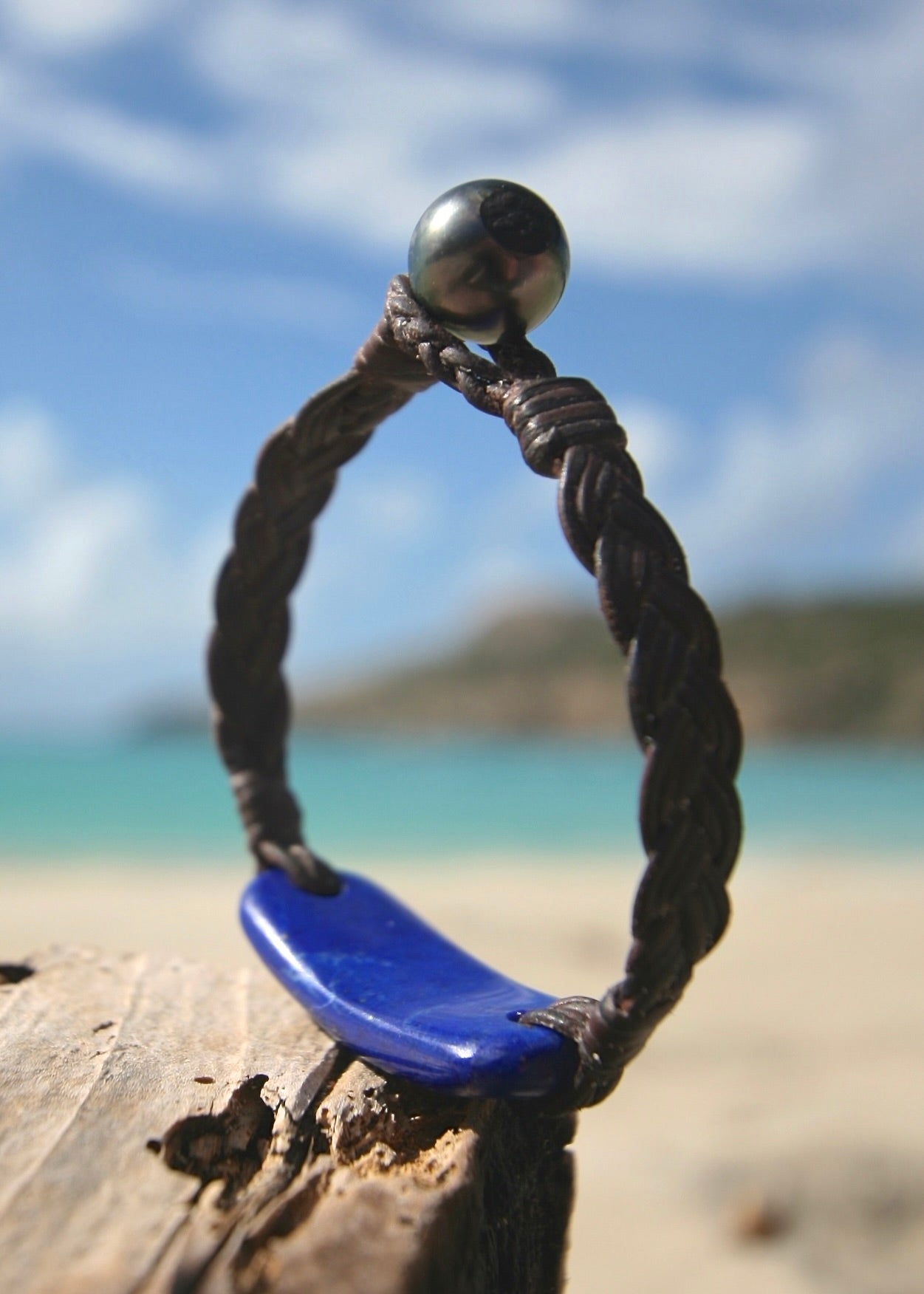 Trésors de St Barth lapis lazuli bracelet with Tahitian pearl clasp on braided kangaroo leather on sand