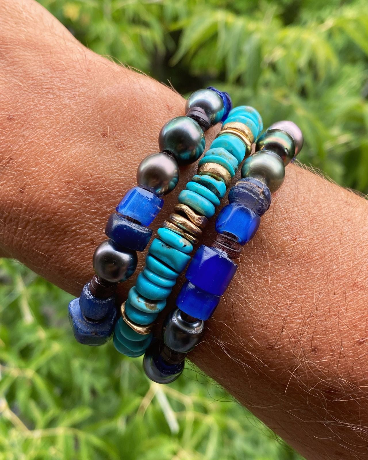 Stacked lapis lazuli, turquoise and pearl beaded bracelets worn on wrist, one of a kind jewelry St Barth