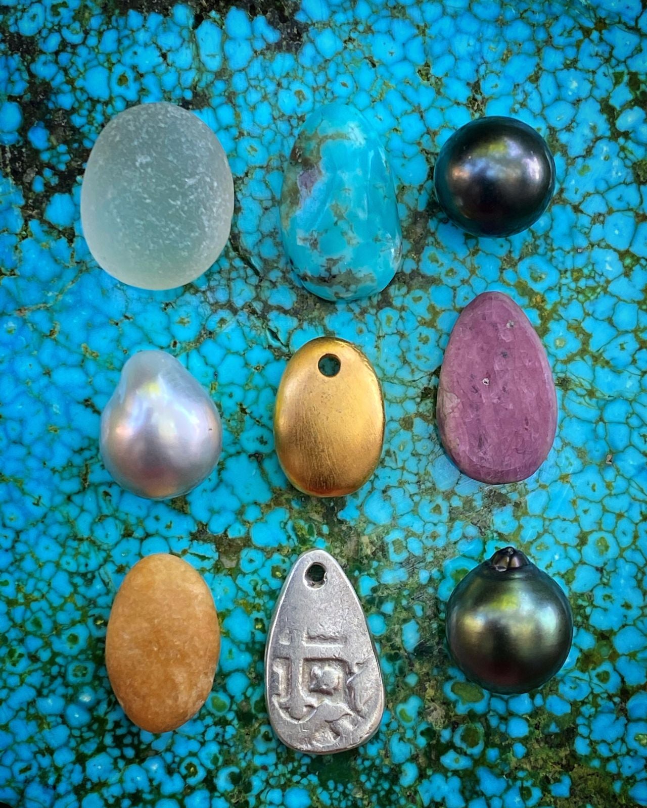 Raw turquoise matrix with pearls and assorted gemstones on turquoise slab, one of a kind jewelry St Barth